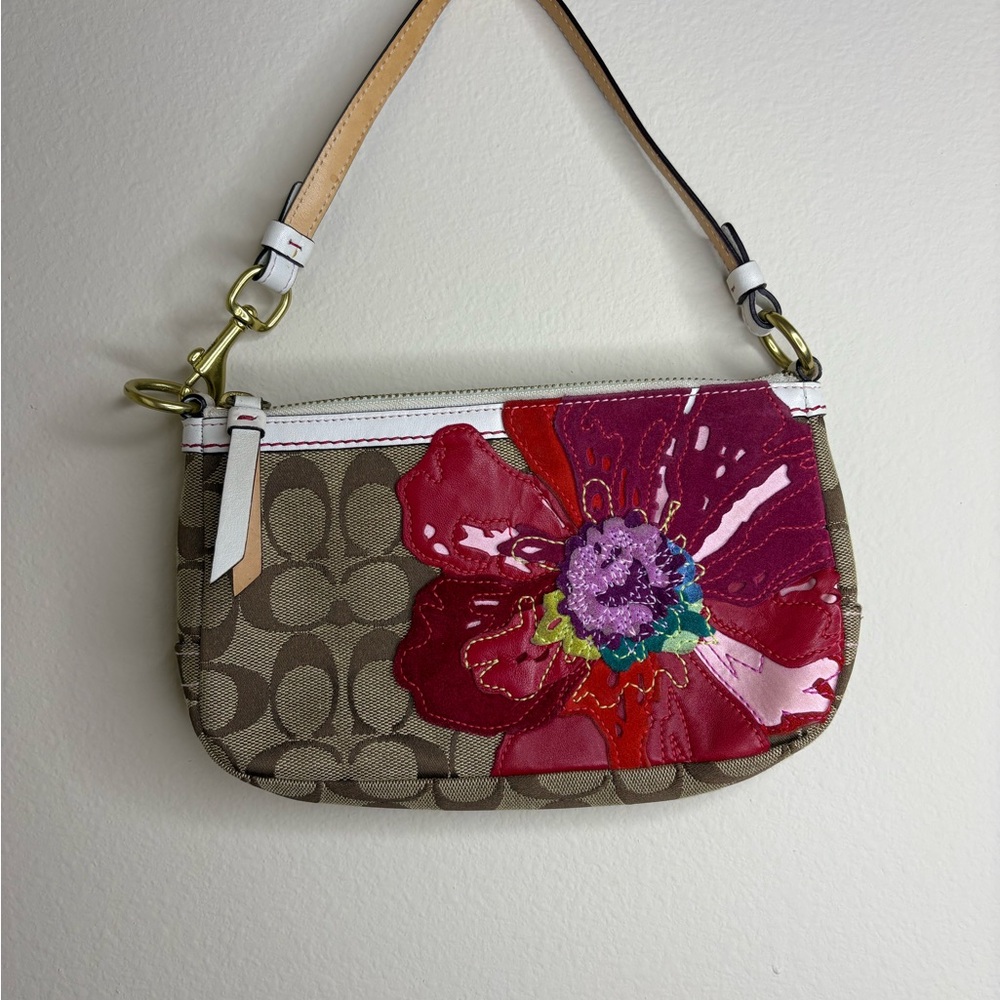 Coach with Poppy Flower wristlet.  New without tags.